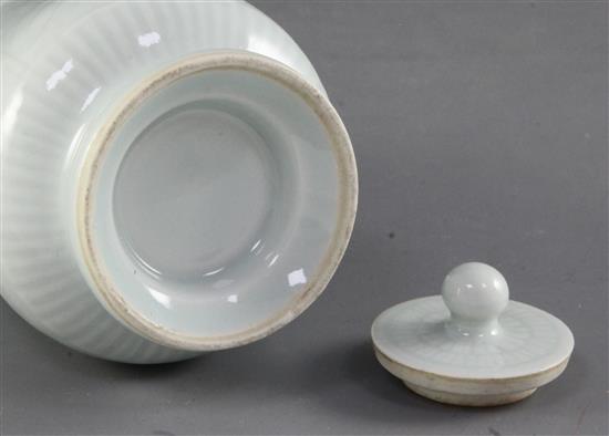 A Chinese pale celadon glazed wine pot and cover, probably Republic period, height 14.4cm, handle broken and restuck
